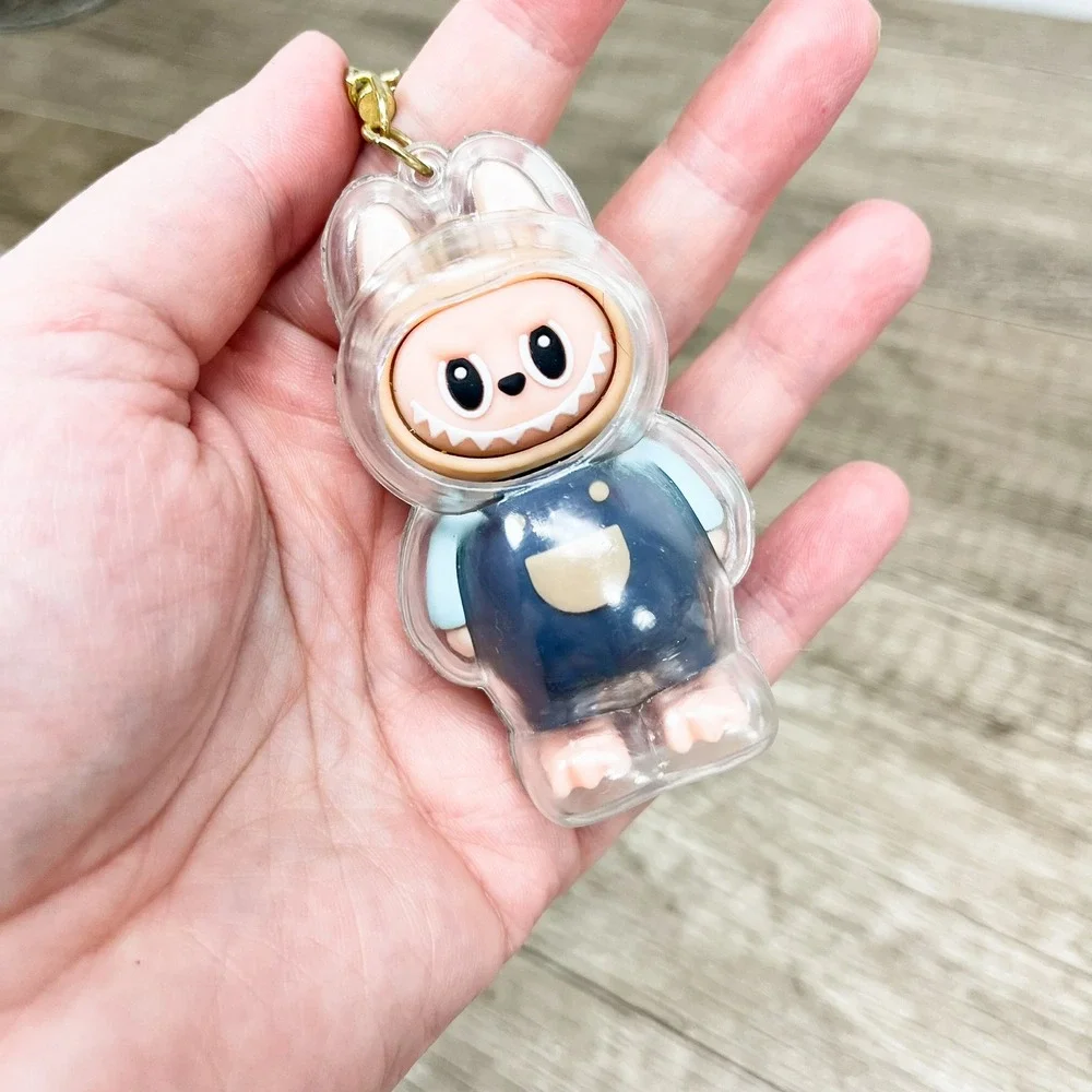 Labubu Monster Art Toy Keychain Blue Overalls Clear Protective Case Gold Tone